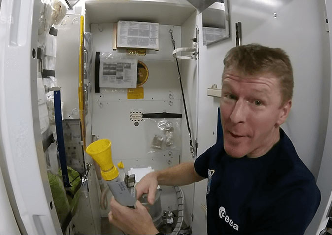 How do astronauts use the toilet in space?
